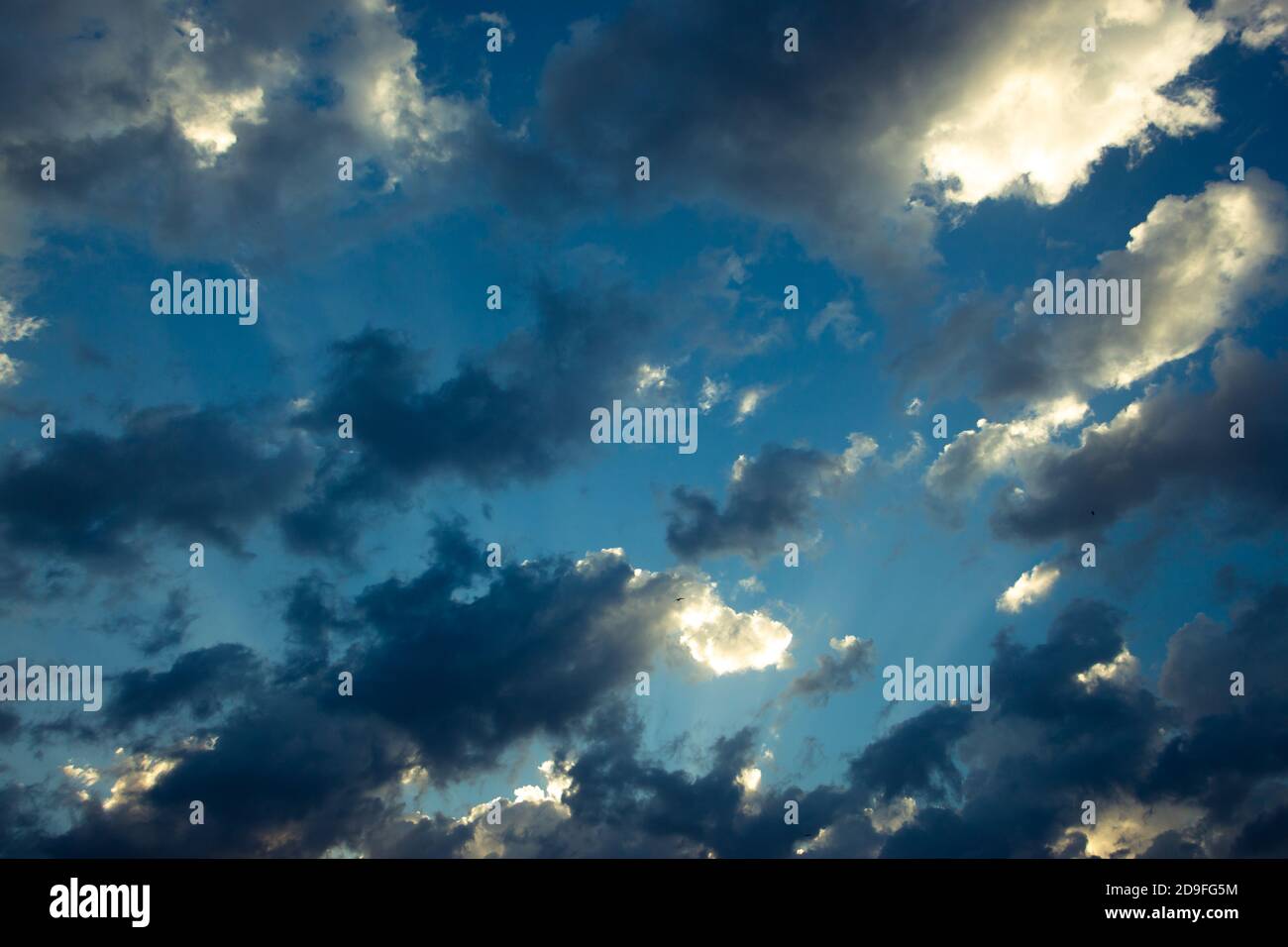 Sunlight beams and cloudy sky Stock Photo