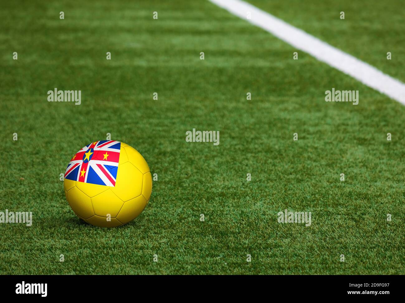 Niue flag on ball at soccer field background. National football theme ...