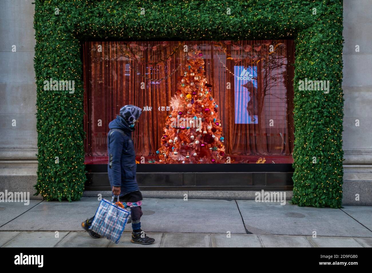 London, UK. 02nd Nov, 2020. Selfridges revealed its Christmas window displays today with unlucky timing. A few people are still out in Oxford Street, despite the new lockdown which came in to force today. Credit: Guy Bell/Alamy Live News Stock Photo