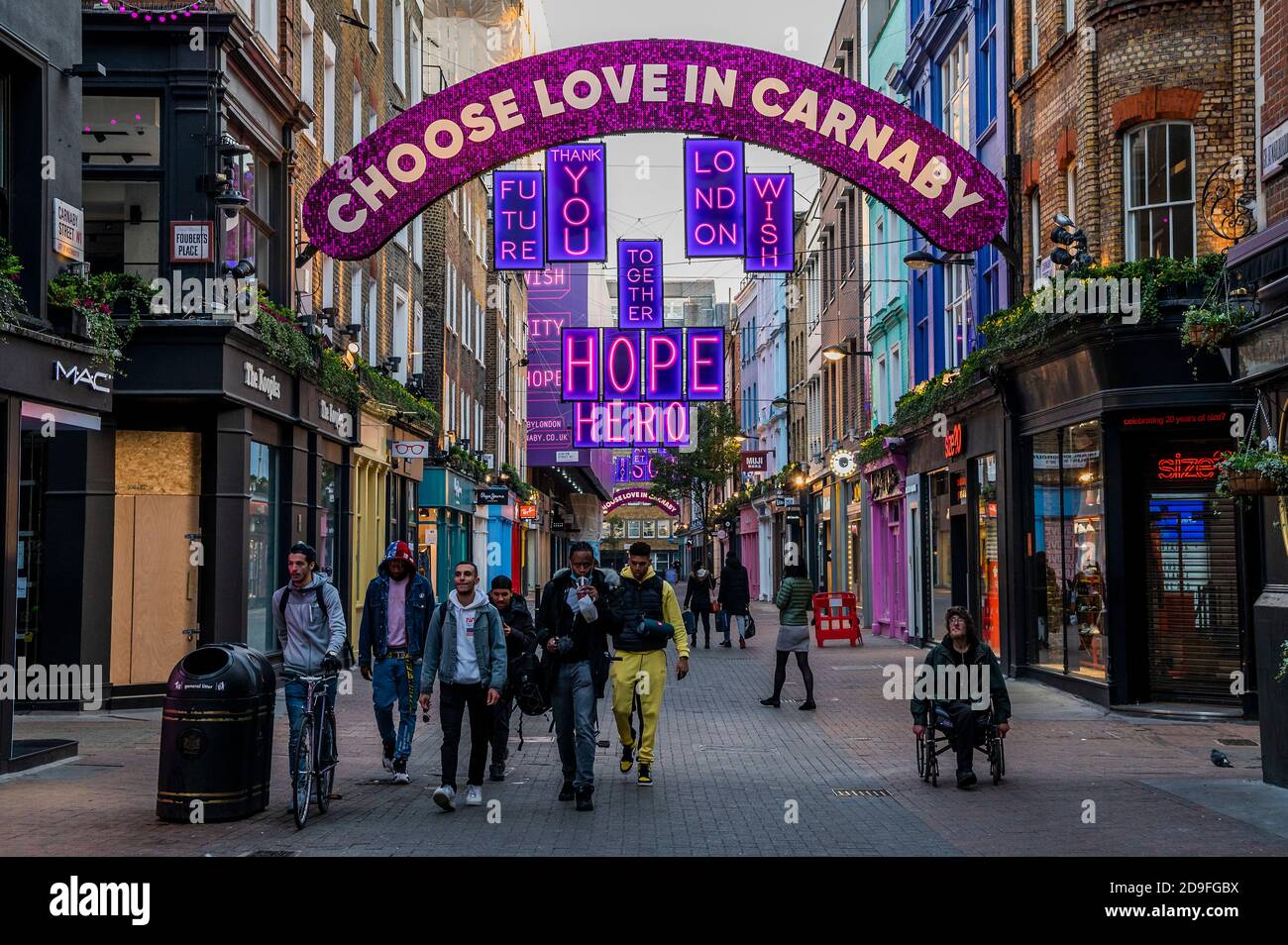 London, UK. 02nd Nov, 2020. Carnaby Street Christmas decorations are up with unlucky timing. A few people are still out, despite the new lockdown which came in to force today. Credit: Guy Bell/Alamy Live News Stock Photo