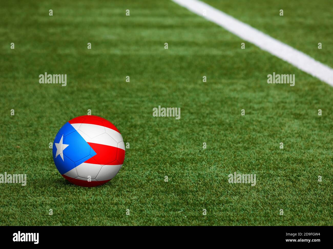 Puerto Rico flag on ball at soccer field background. National football theme on green grass