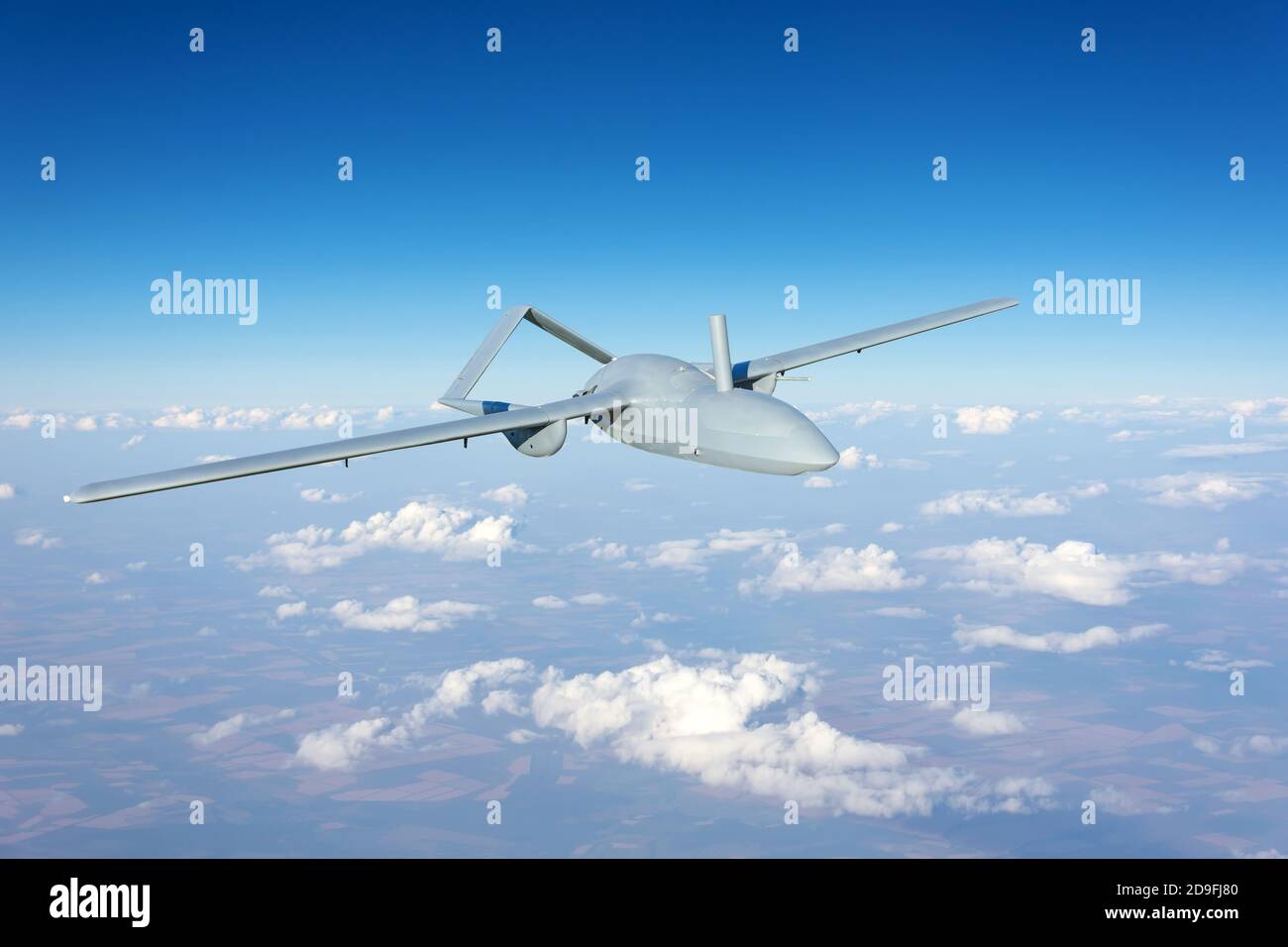 Unmanned military drone uav flying reconnaissance in the air high in the sky in the border areas Stock Photo