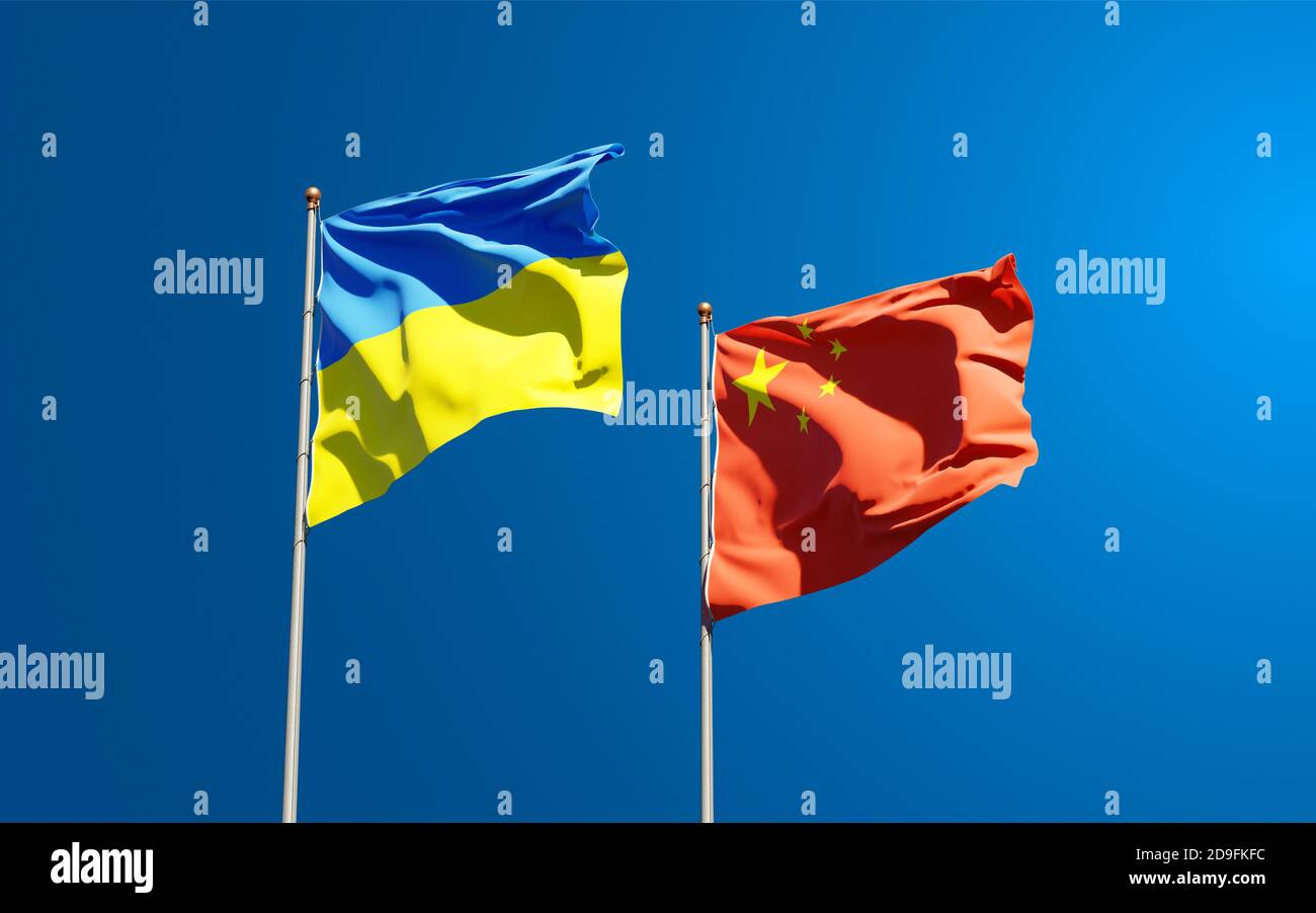 Beautiful national state flags of Ukraine and China together at the sky ...