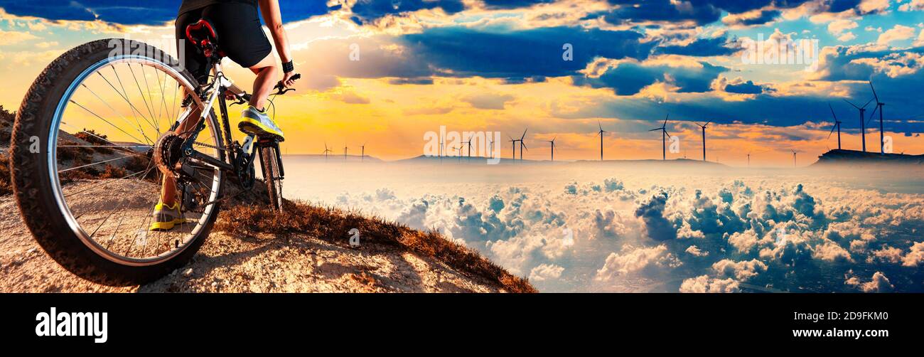 Exercise and healthy lifestyle. Biker and scenic mountain landscape