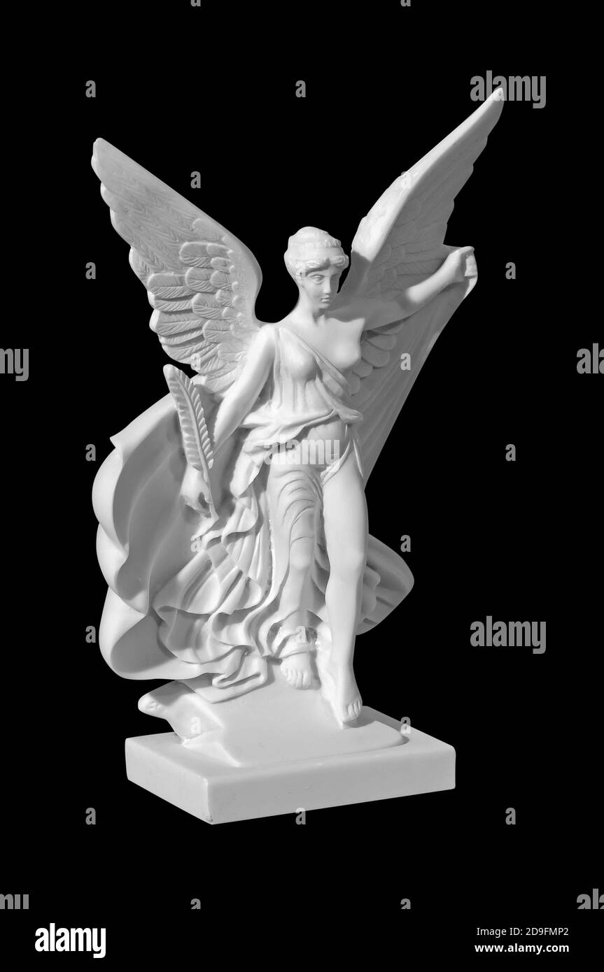 Beautiful young woman angel statue with a black background Stock Photo