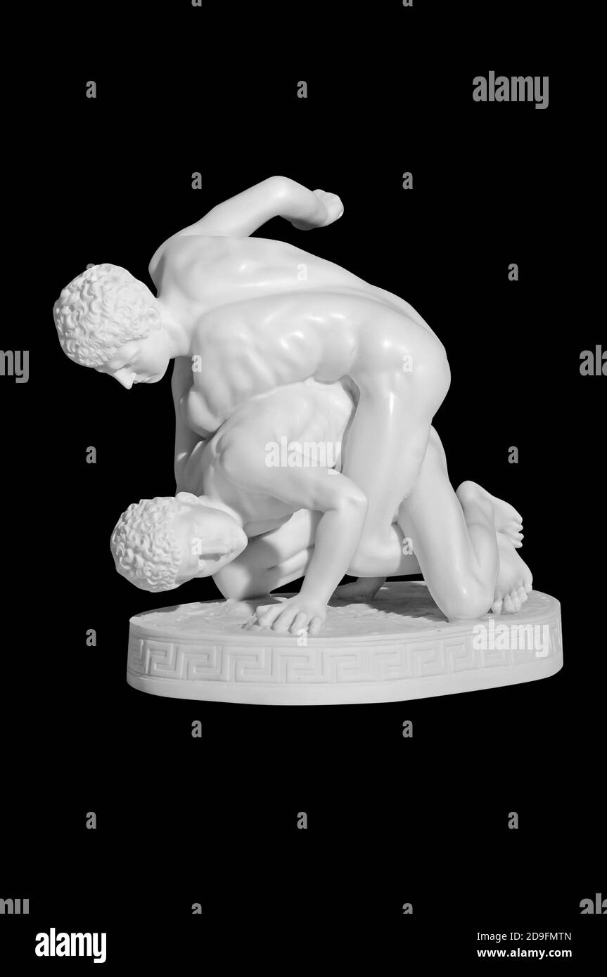Classical marble figurine of wrestlers on a black background Stock Photo