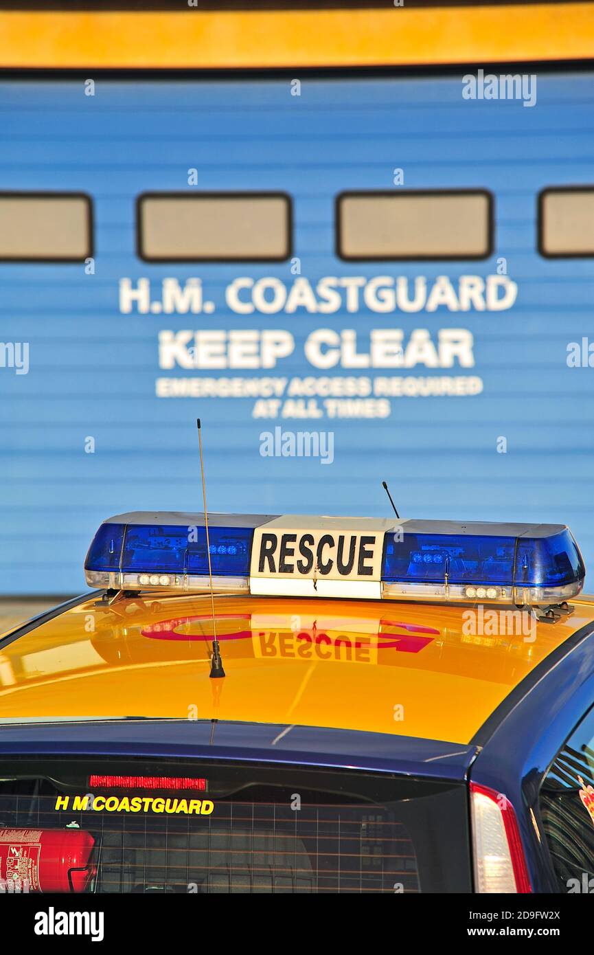 HM Coastguard rescue vehicle in front of station garage doors Stock Photo