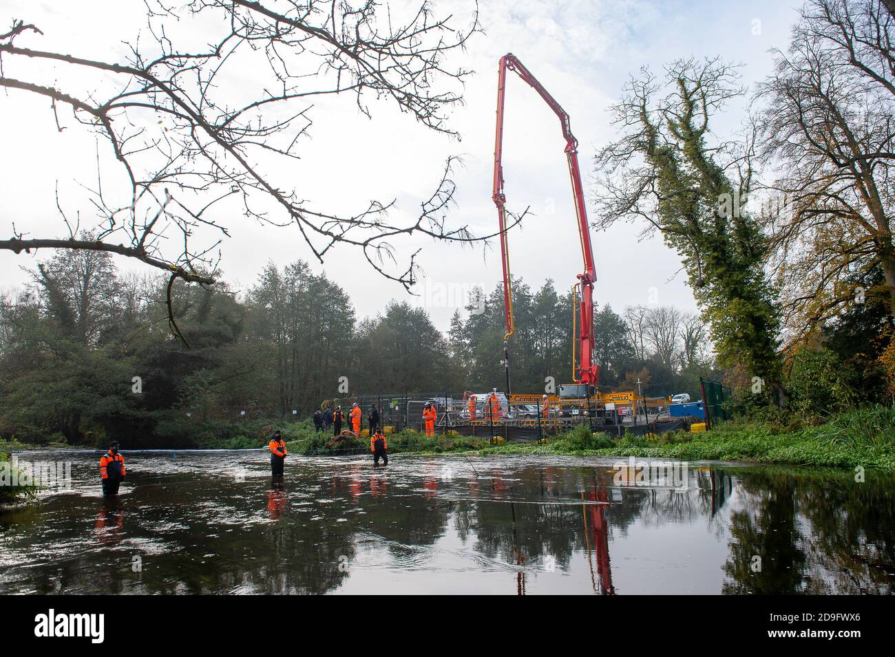 Denham, Buckinghamshire, UK. 5th November, 2020. Despite England now being in a Covid-19 national lockdown for the second time, HS2 are being allowed to continue with their construction work for the new High Speed rail from London to Birmingham. Concrete was being pumped into the foundations for a new HS2 bridge across the chalk stream River Colne in Denham Country Park today. Credit: Maureen McLean/Alamy Live News Stock Photo