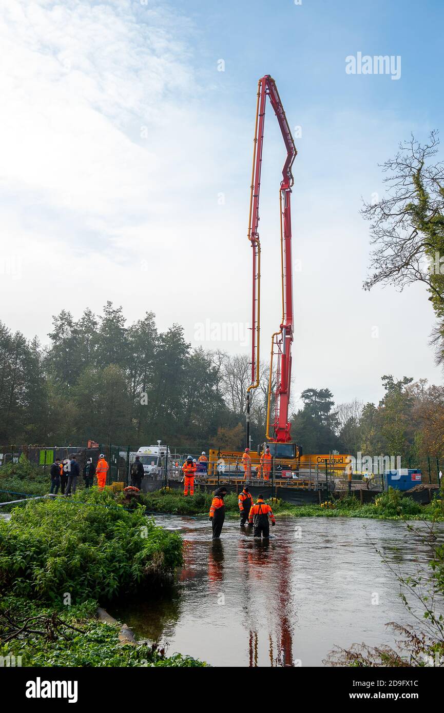 Denham, Buckinghamshire, UK. 5th November, 2020. Despite England now being in a Covid-19 national lockdown for the second time, HS2 are being allowed to continue with their construction work for the new High Speed rail from London to Birmingham. Concrete was being pumped into the foundations for a new HS2 bridge across the chalk stream River Colne in Denham Country Park today. Credit: Maureen McLean/Alamy Live News Stock Photo