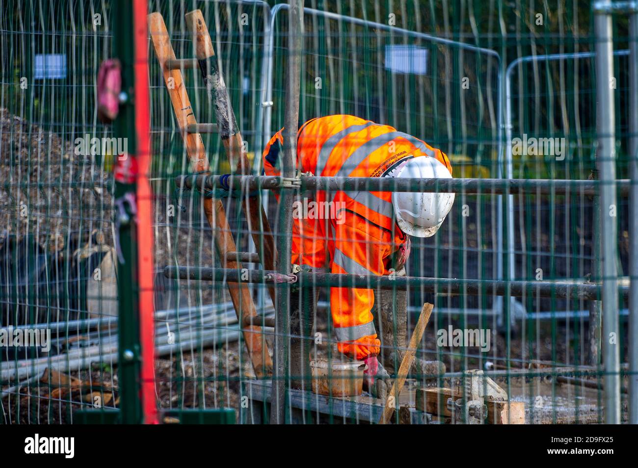 Denham, Buckinghamshire, UK. 5th November, 2020. Despite England now being in a Covid-19 national lockdown for the second time, HS2 are being allowed to continue with their construction work for the new High Speed rail from London to Birmingham. Concrete was being pumped into the foundations for a new HS2 bridge across the chalk stream River Colne in Denham Country Park today. Credit: Maureen McLean/Alamy Live News Stock Photo