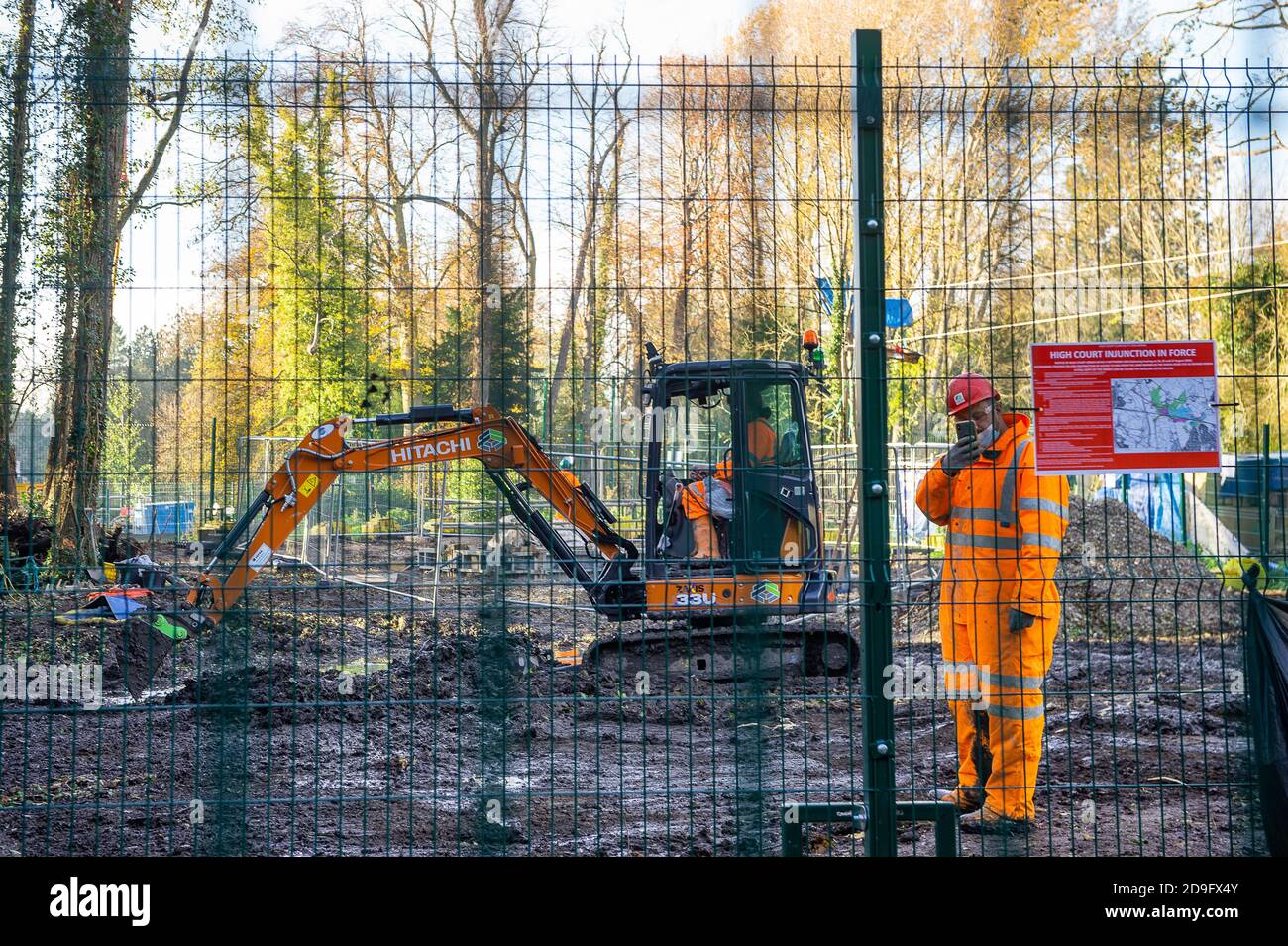 Denham, Buckinghamshire, UK. 5th November, 2020. A HS2 security guards films a member of the press. Despite England now being in a Covid-19 national lockdown for the second time, HS2 are being allowed to continue with their construction work for the new High Speed rail from London to Birmingham. Concrete was being pumped into the foundations for a new HS2 bridge across the chalk stream River Colne in Denham Country Park today. Credit: Maureen McLean/Alamy Live News Stock Photo