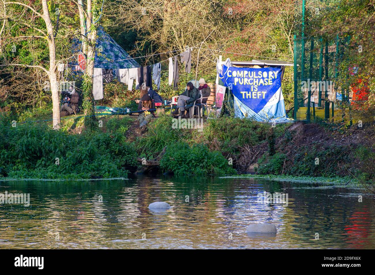 Denham, Buckinghamshire, UK. 5th November, 2020. The Denham Ford Protection Camp. Despite England now being in a Covid-19 national lockdown for the second time, HS2 are being allowed to continue with their construction work for the new High Speed rail from London to Birmingham. Concrete was being pumped into the foundations for a new HS2 bridge across the chalk stream River Colne in Denham Country Park today. Credit: Maureen McLean/Alamy Live News Stock Photo