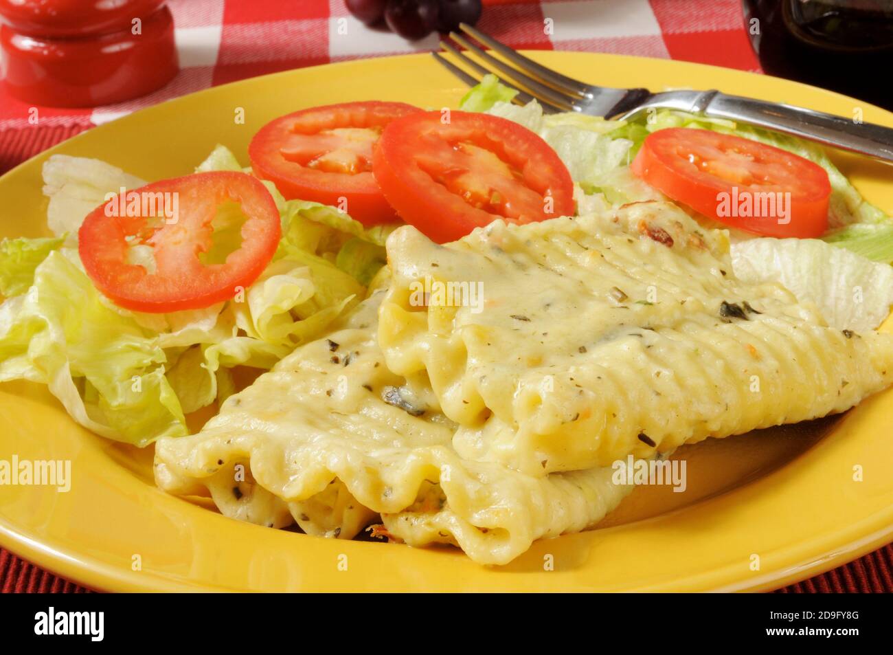Spinich rollatini with ricotta cheese and alfredo sauce Stock Photo Alamy