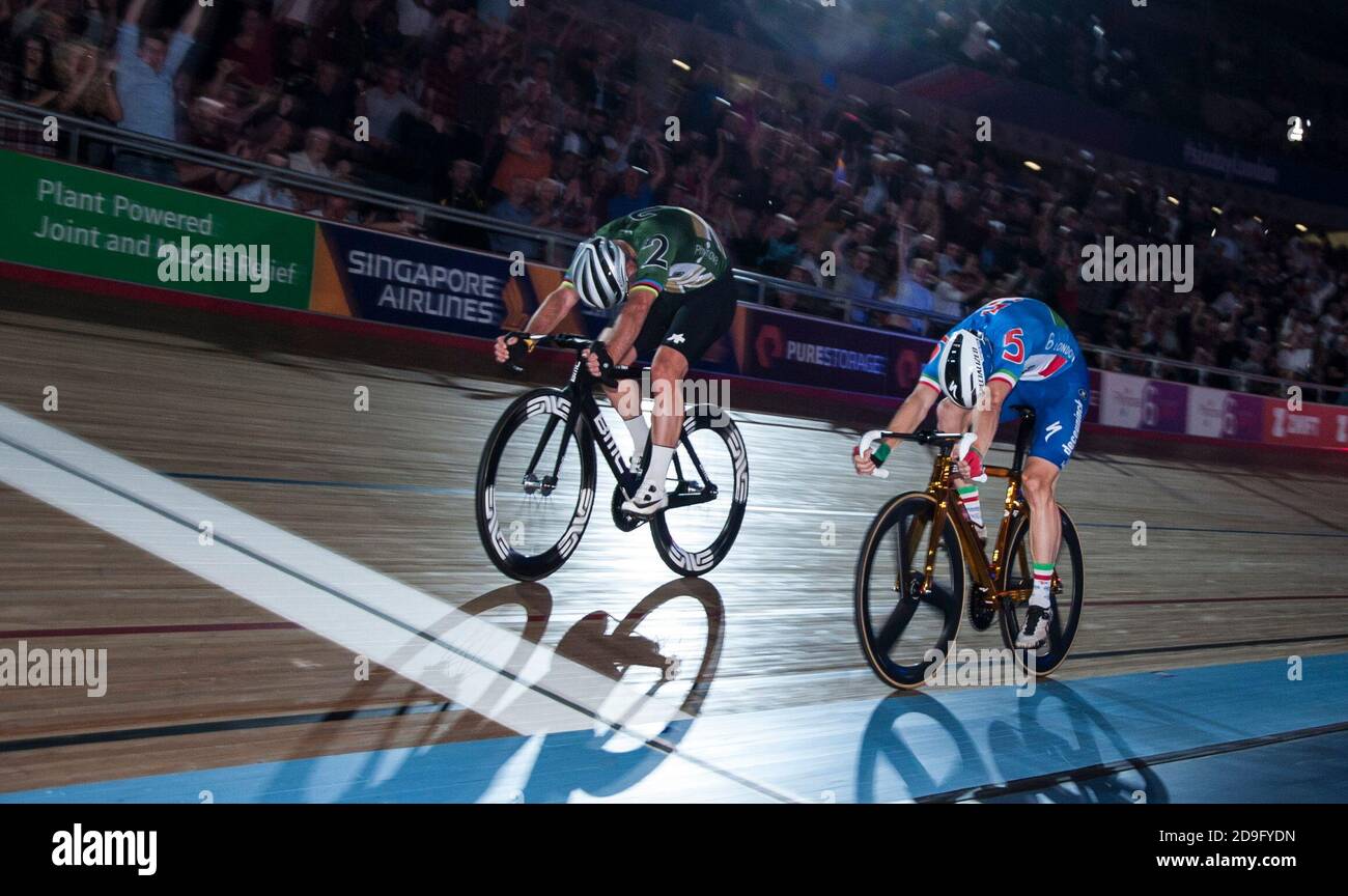 Mark Cavendish rolls Elia Viviani as they both throw for the line. Riders were taking part in the Six Day track championship at Lee Valley Velodrome, London Stock Photo