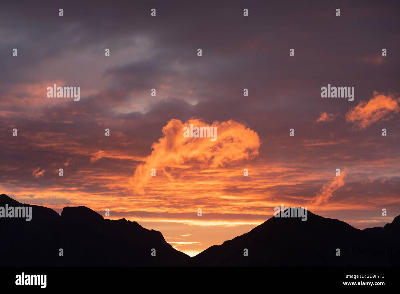 Colorful sunset over mountains in Norway Stock Photo