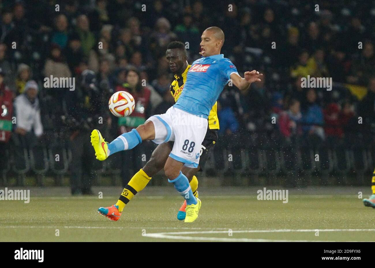 Gökhan Inler  of S.S.C. Napoli and Sekou Junior Sanogo of Young Boys Berne during the Europa League  2014 - 2015 Young Boys Berne - S.S.C. Napoli , Stade de Suisse  on October 23 2014 in Berne ,Suisse- Photo Laurent Lairys/ DPPI Stock Photo