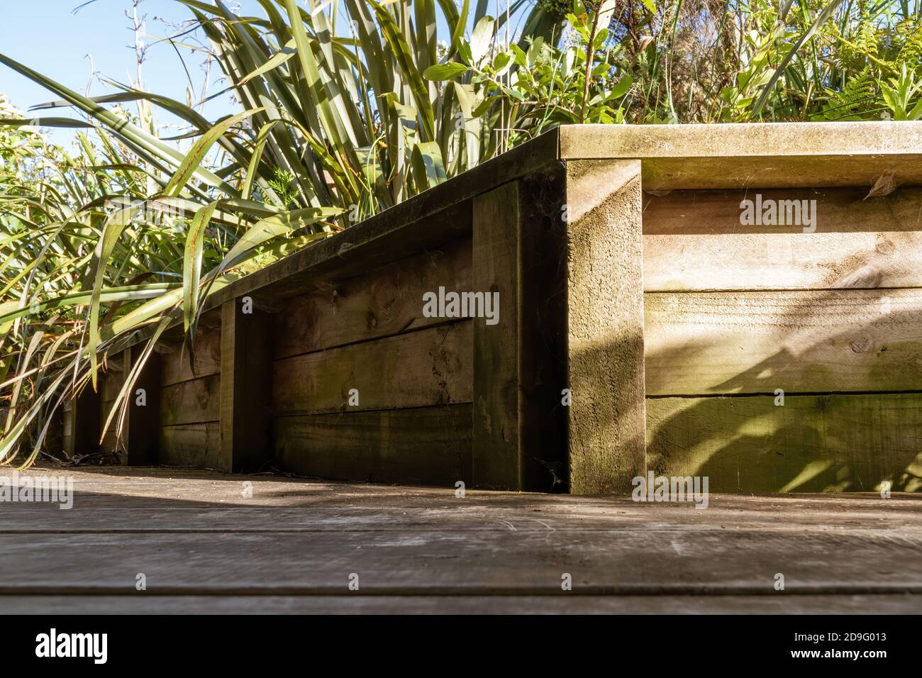 Small wooden retaining wall with corner Stock Photo Alamy