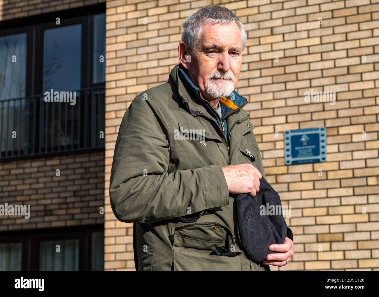 Dr Mike Ewart, Director Scottish International Education Trust SIET founded by Sir Sean Connery memorial plaque, Fountainbridge, Edinburgh, Scotland Stock Photo