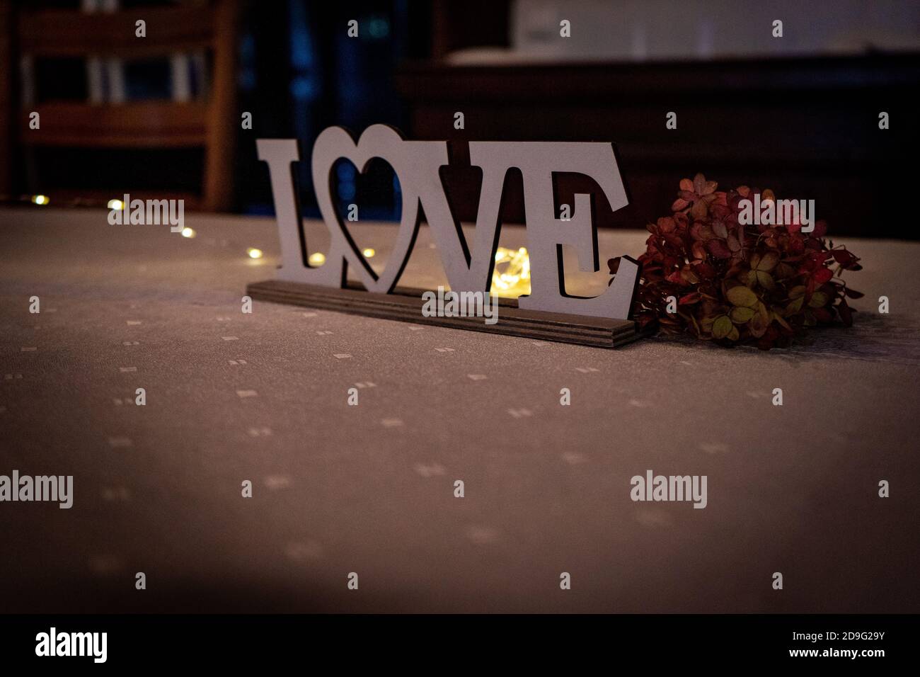 love sign on a table as wedding decoration Stock Photo