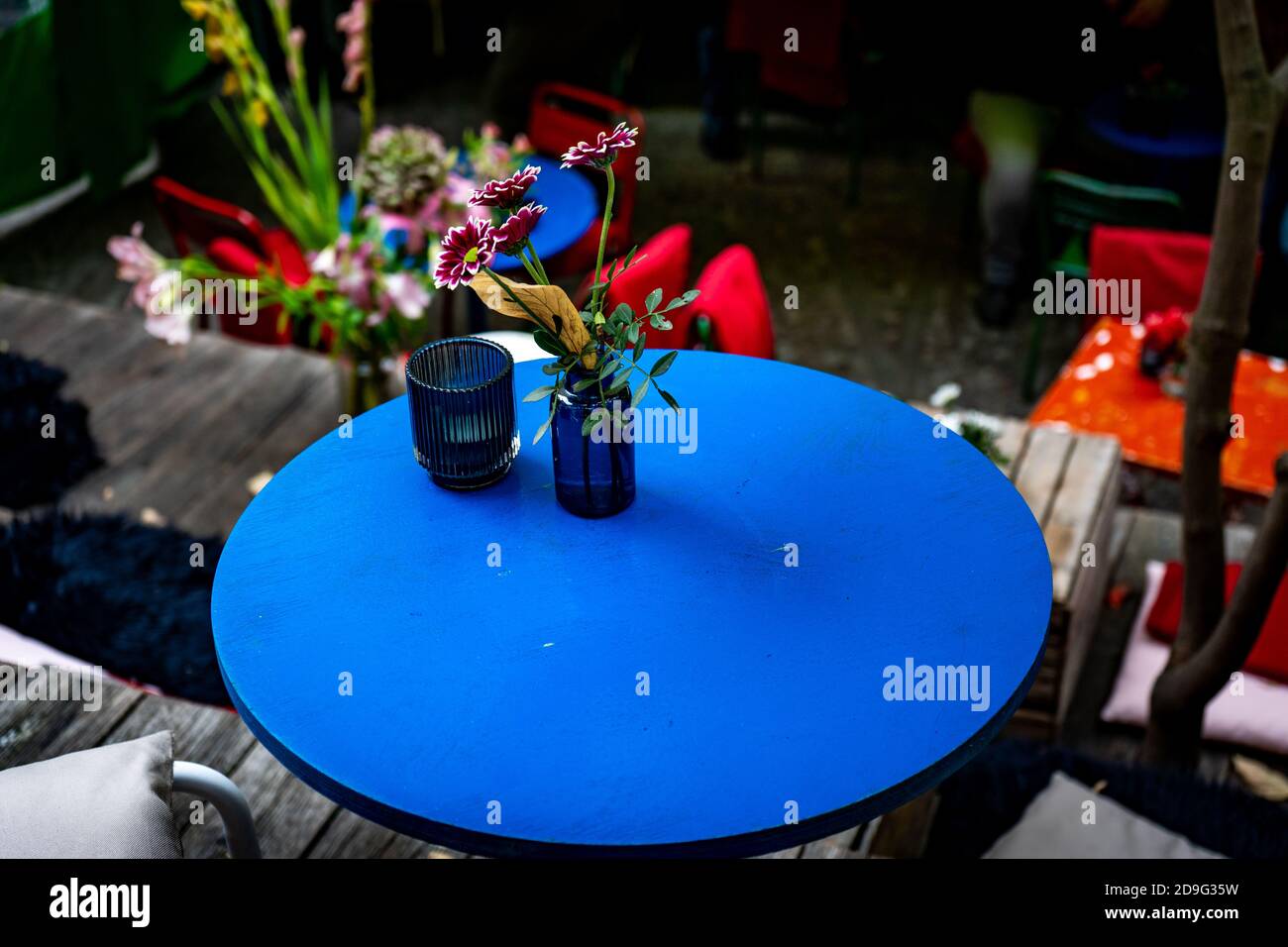blue table in a cafe with flowers Stock Photo