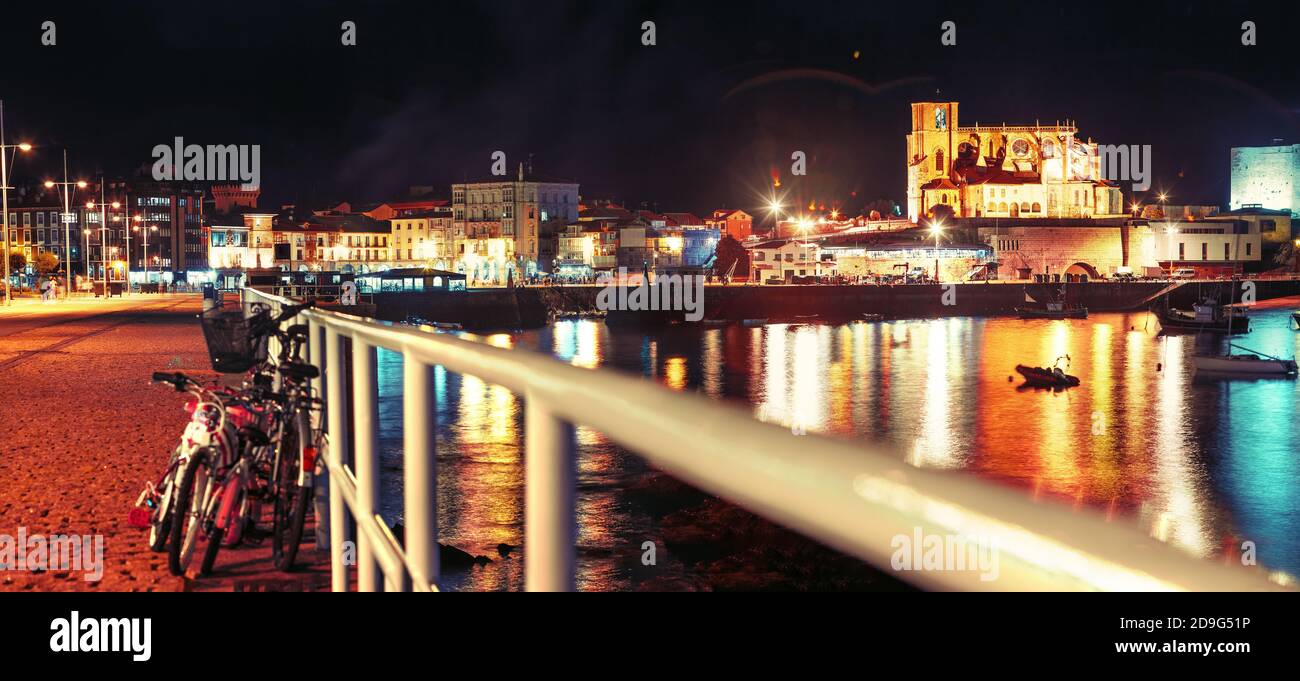 Scenery landscape of fishing port.Cityscape at night and boats in the sea.Cantabria village.Castrourdiales.Beautiful skyline panoramic in Spain landma Stock Photo