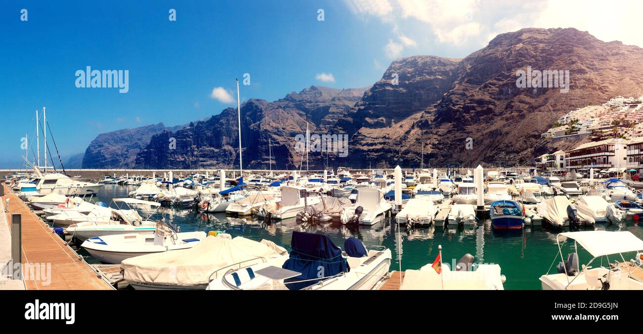 Seaport with boats and yachts in nature.Los Gigantes Cliff, Canary Islands, Tenerife, Spain Stock Photo