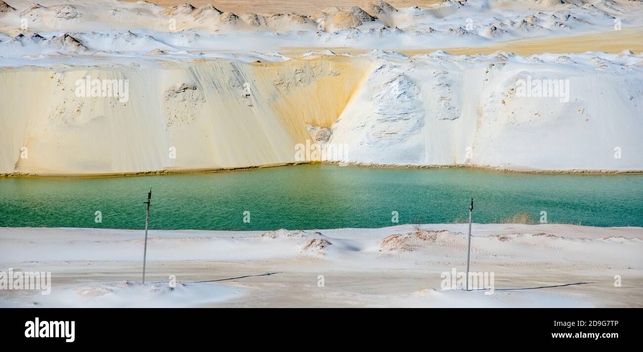 quartz white sand quarry with blue lake Stock Photo