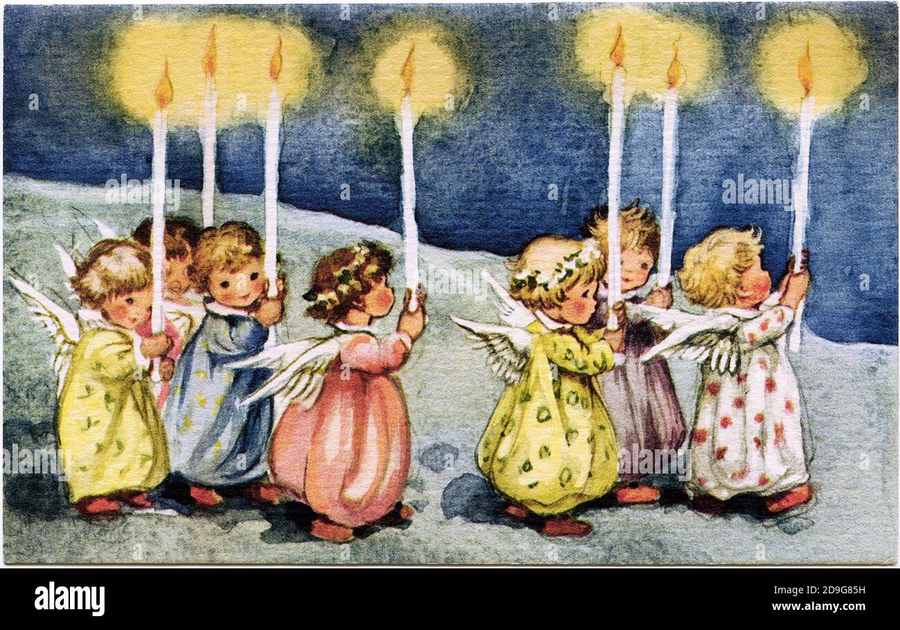 Christmas time. Children with burning candles. Old and beautiful Christmas Card. Stock Photo