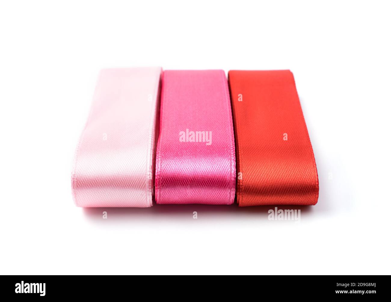 Three Color Ribbon Silk ribbons in three colors on a white background Stock Photo - Alamy