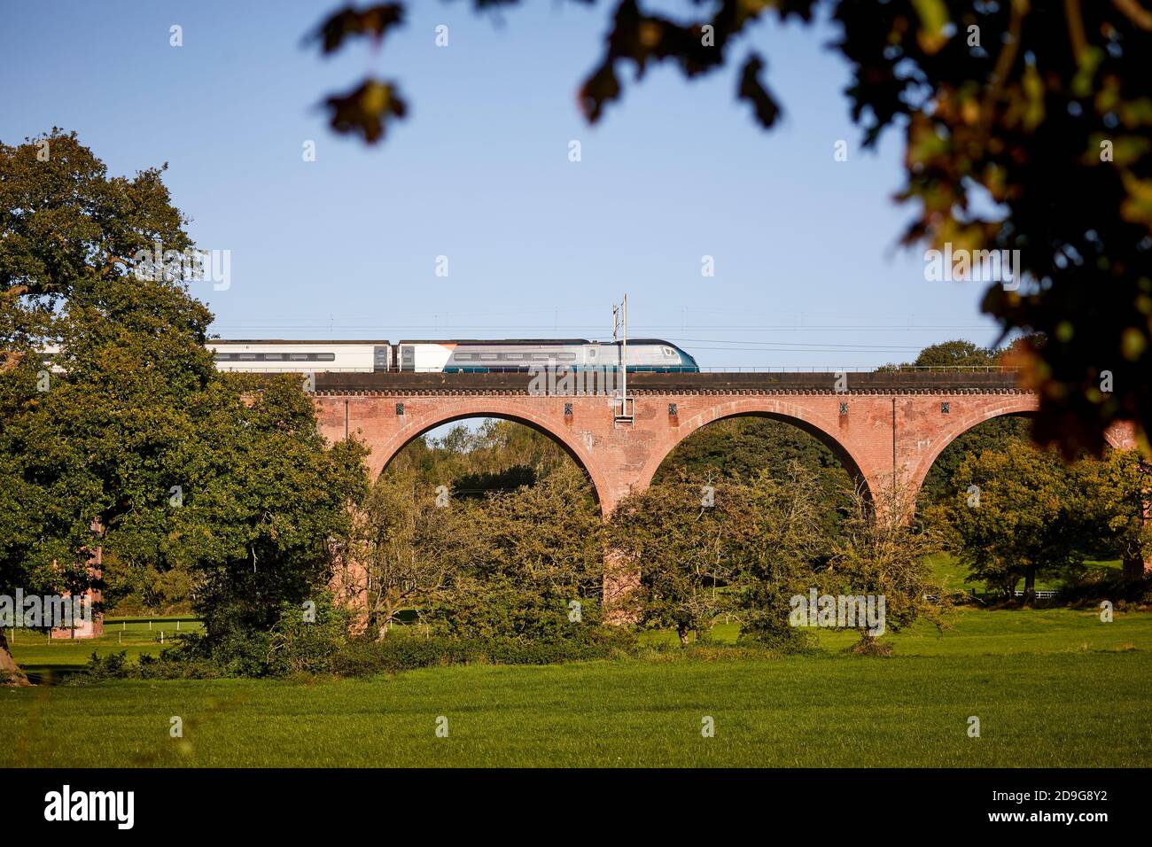 Twemlow Viaduct at Holmes Chapel a Avanti West Coast class 390 Pendolino on a Manchester London WCML service Stock Photo