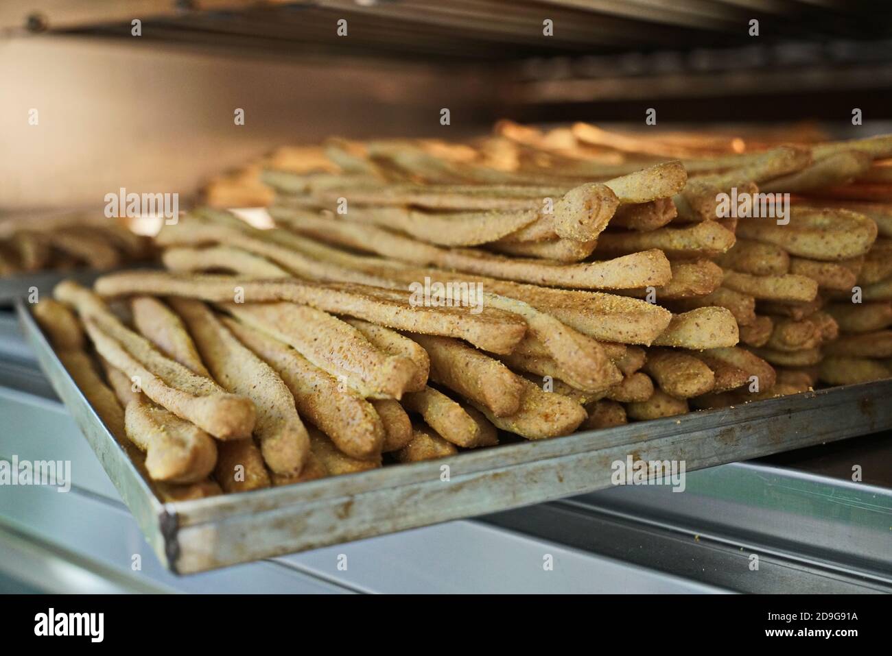 Whole corn bread sticks in the oven Stock Photo