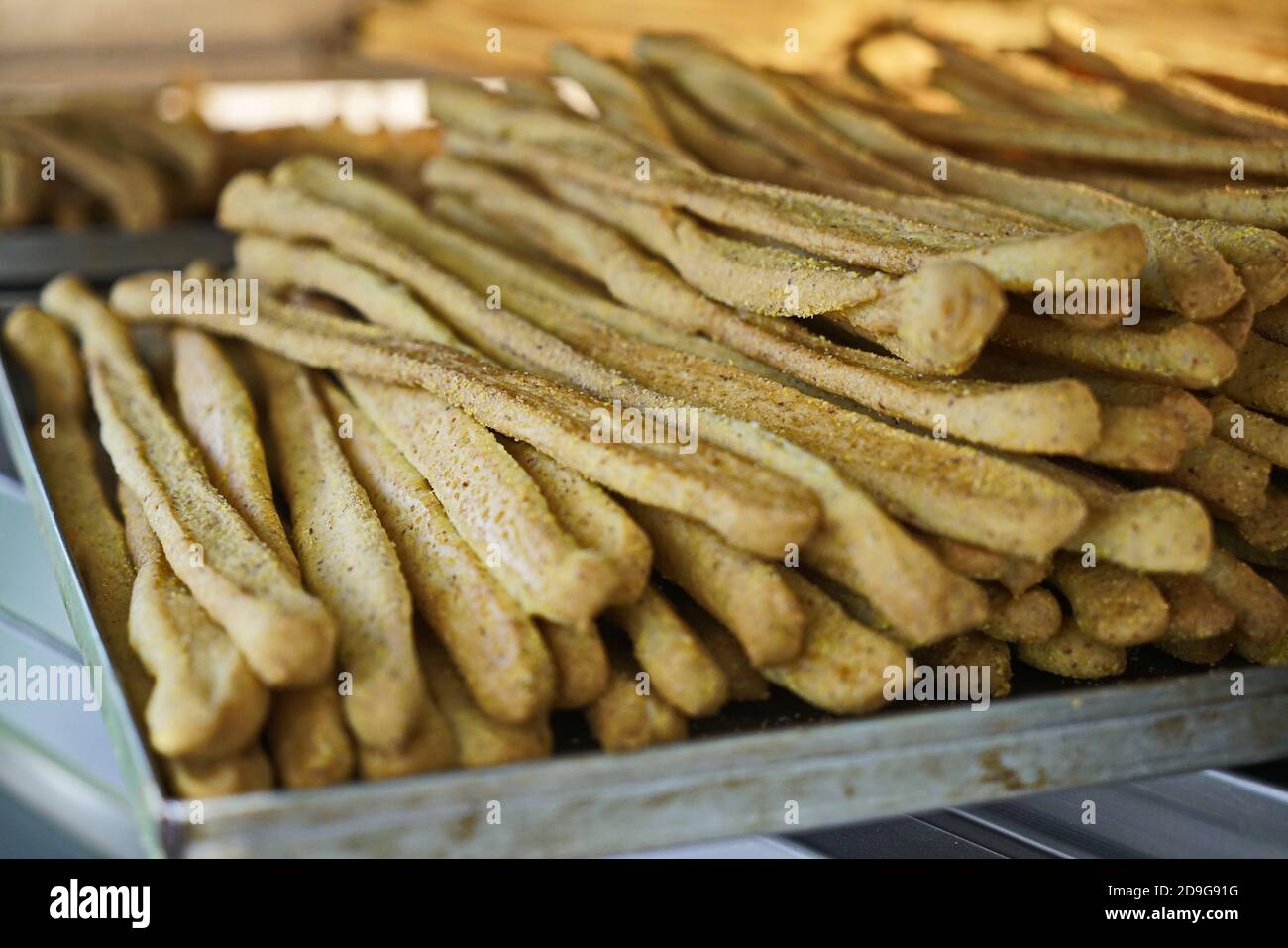 Whole corn bread sticks in the oven Stock Photo