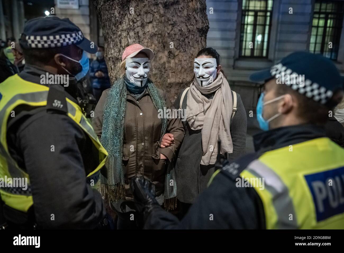 Coronavirus: Anti-lockdown / Million Mask March. A few hundred anti-government protesters and activists including anti-lockdown demonstrators gather in Trafalgar Square before marching through the city on Guy Fawkes night for the annual ‘Million Mask March’ protest against government corruption and other political issues. Associated with the hacker group Anonymous, the annual protest typically falls on the anniversary of Guy Fawkes’s attempt to blow up parliament and is inspired in part by the film and graphic novel V for Vendetta. London, UK. Stock Photo