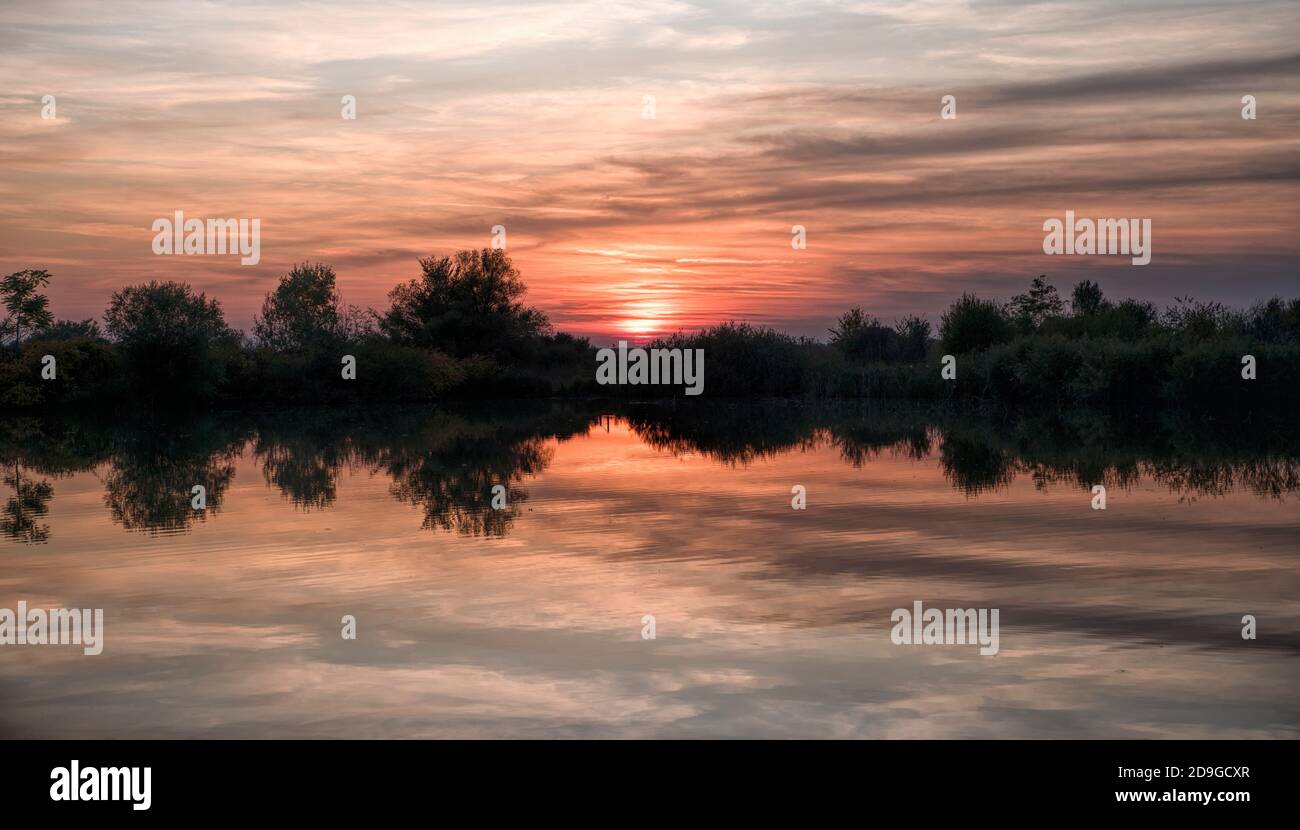 Dramatic Sunset Sky with colorful clouds on lake Stock Photo - Alamy