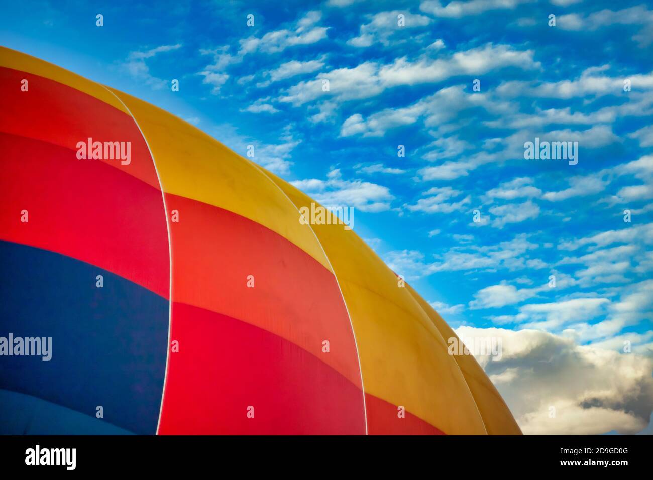 Multicolored balloon against the blue sky Stock Photo