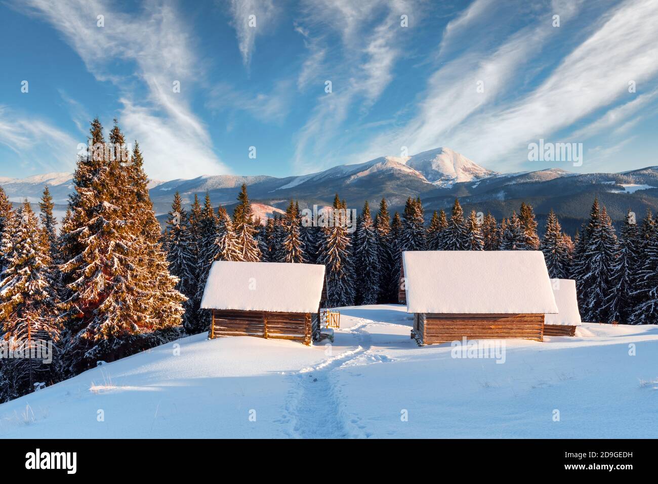 Fantastic winter landscape with wooden house in snowy mountains ...