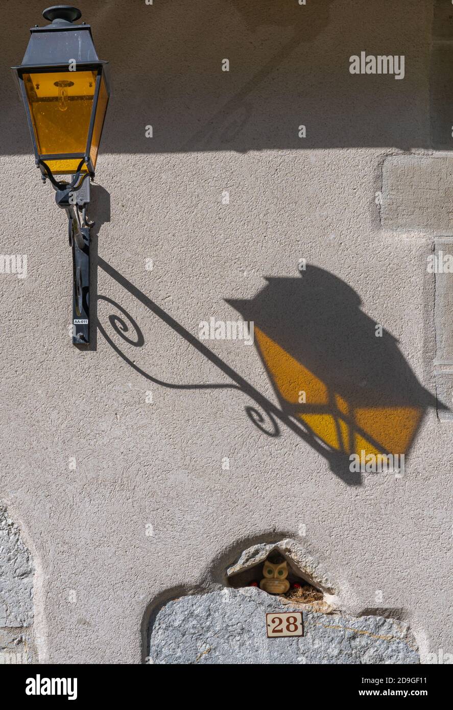 La Frasnee, France - 09 03 2020: The yellow lantern and the owl in its ...