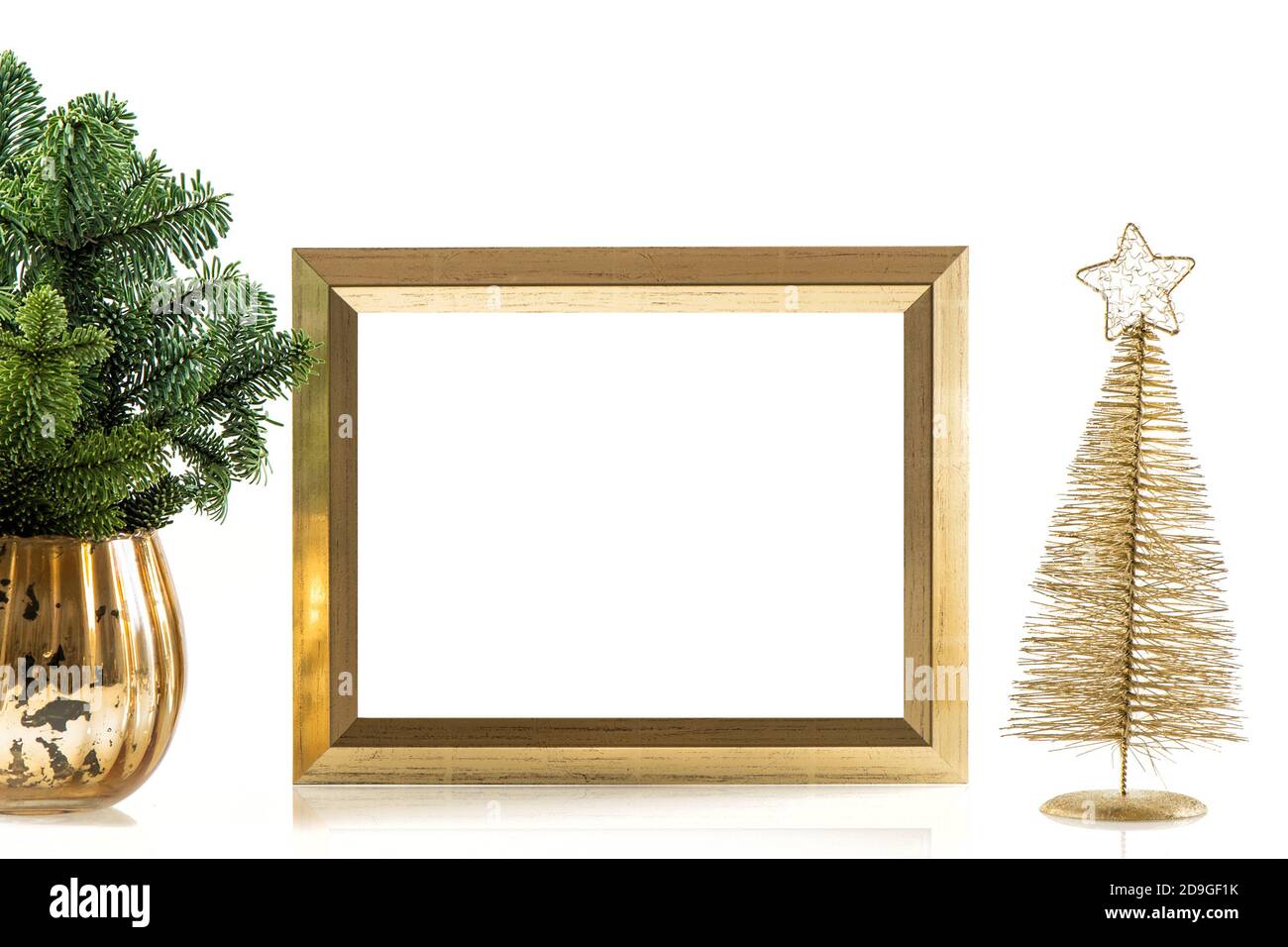 Golden picture frame mockup and Christmas decoration Stock Photo