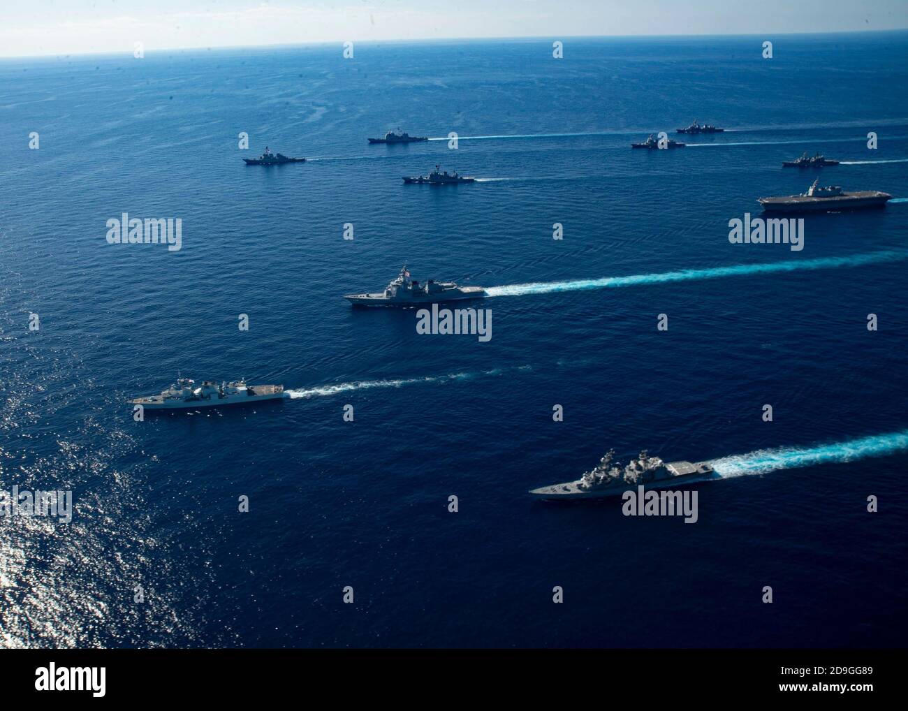 U.S. Navy ships assigned to the Ronald Reagan Carrier Strike Group joined ships of Japan Maritime Self-Defense Force sail in formation during exercise Keen Sword 21 October 26, 2020 in the Philippine Sea. Stock Photo