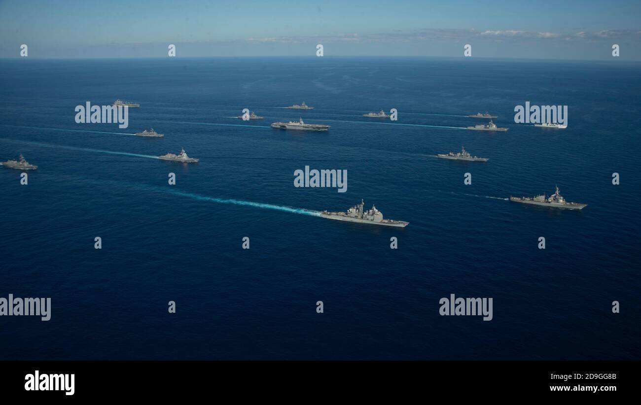 U.S. Navy ships assigned to the Ronald Reagan Carrier Strike Group joined ships of Japan Maritime Self-Defense Force sail in formation during exercise Keen Sword 21 October 26, 2020 in the Philippine Sea. Stock Photo