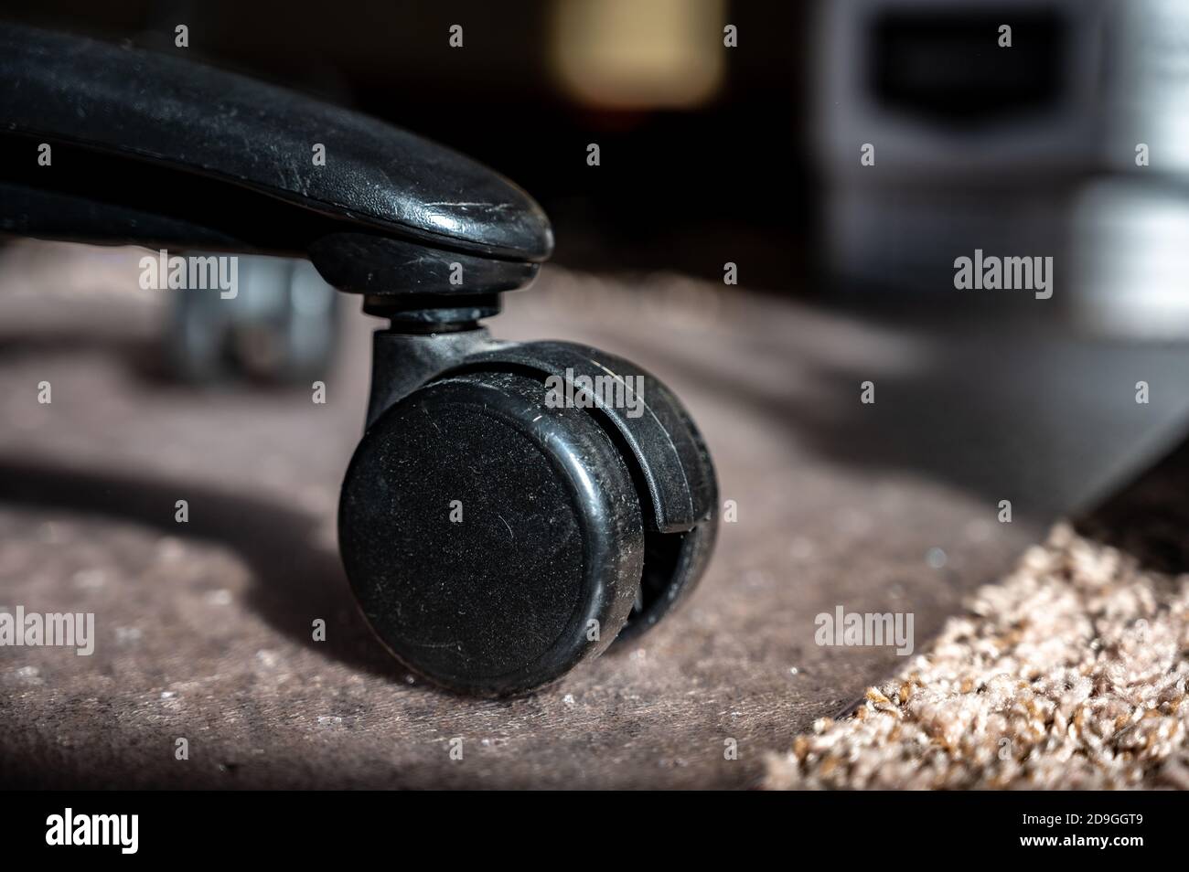 Use of a protective mat over carpet to reduce wheel indents over time