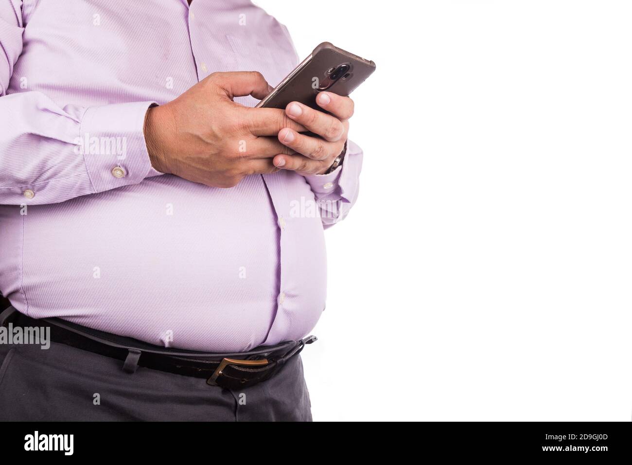 Big belly man with visceral subcutaneous fats in tight shirt Stock Photo