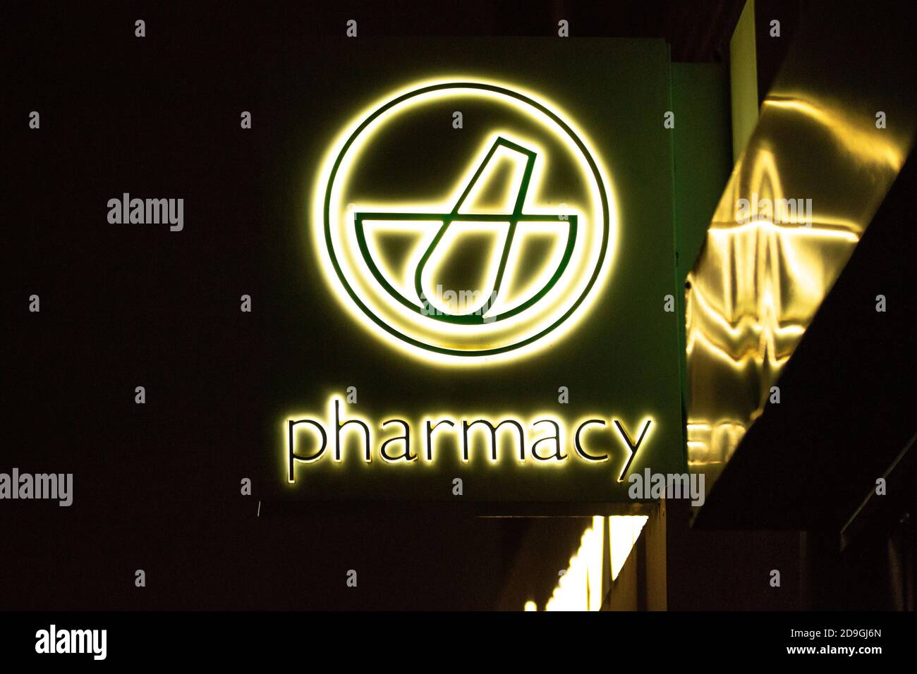 Lloyds Pharmacy (Chemist) sign at night, Birmingham, UK Stock Photo