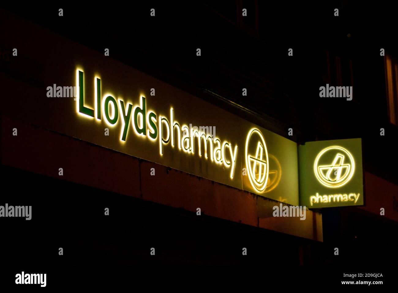 Lloyds Pharmacy (Chemist) sign at night, Birmingham, UK Stock Photo