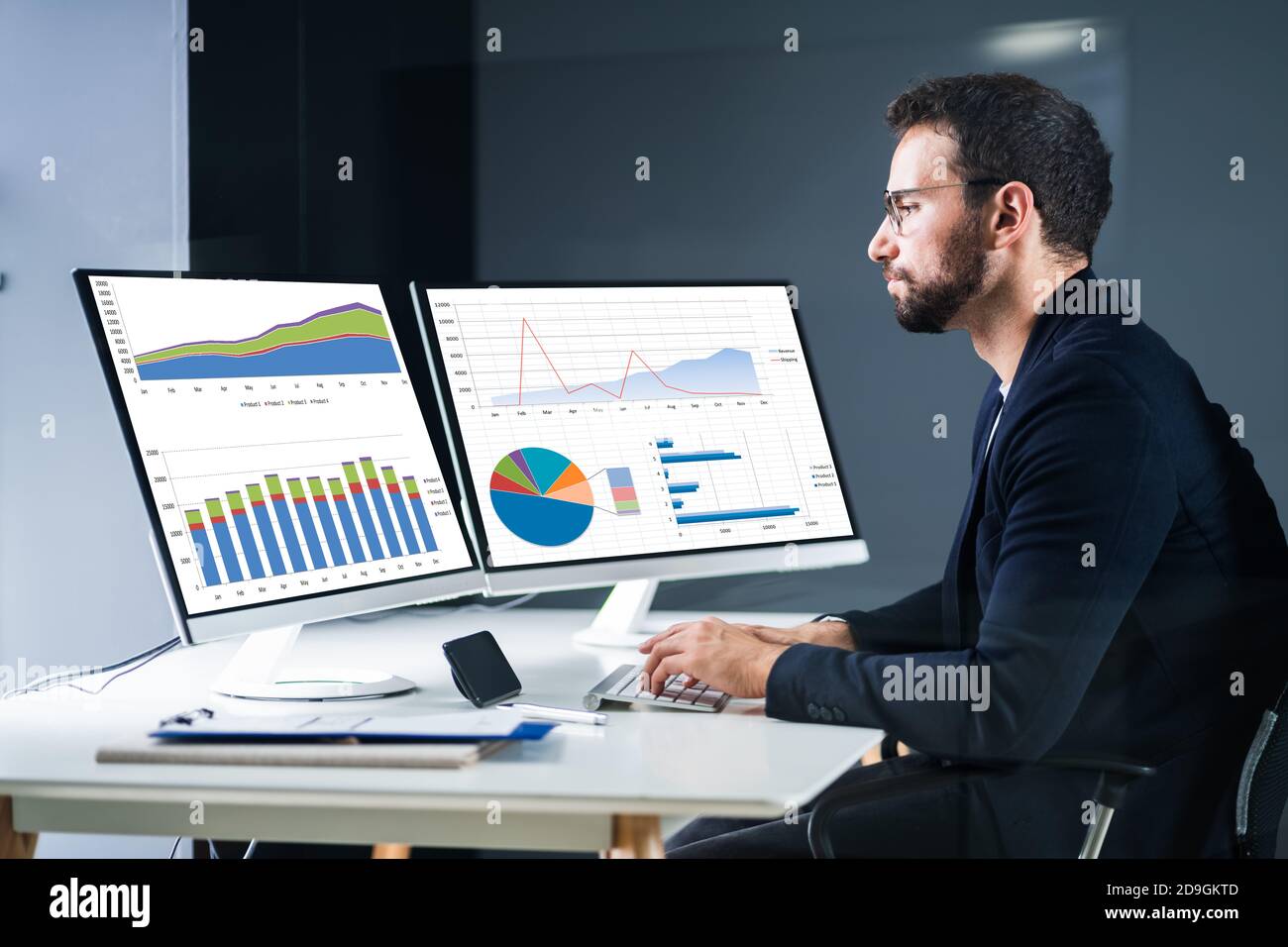 Profitable Graph On Analyst Computer Screen At Desk Stock Photo