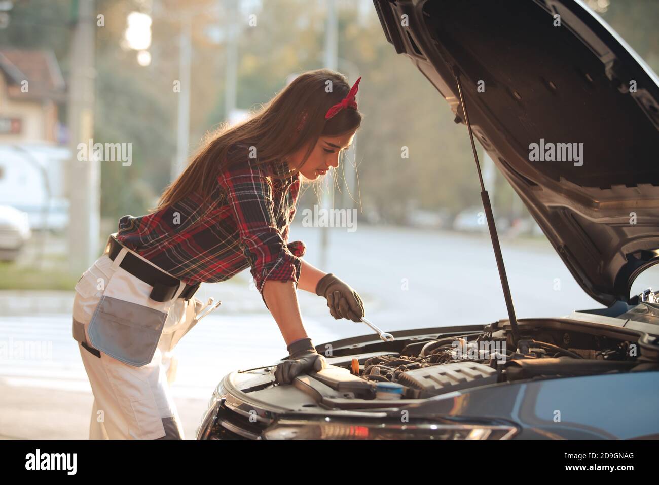 Girl mechanic ar repair shop Stock Photo