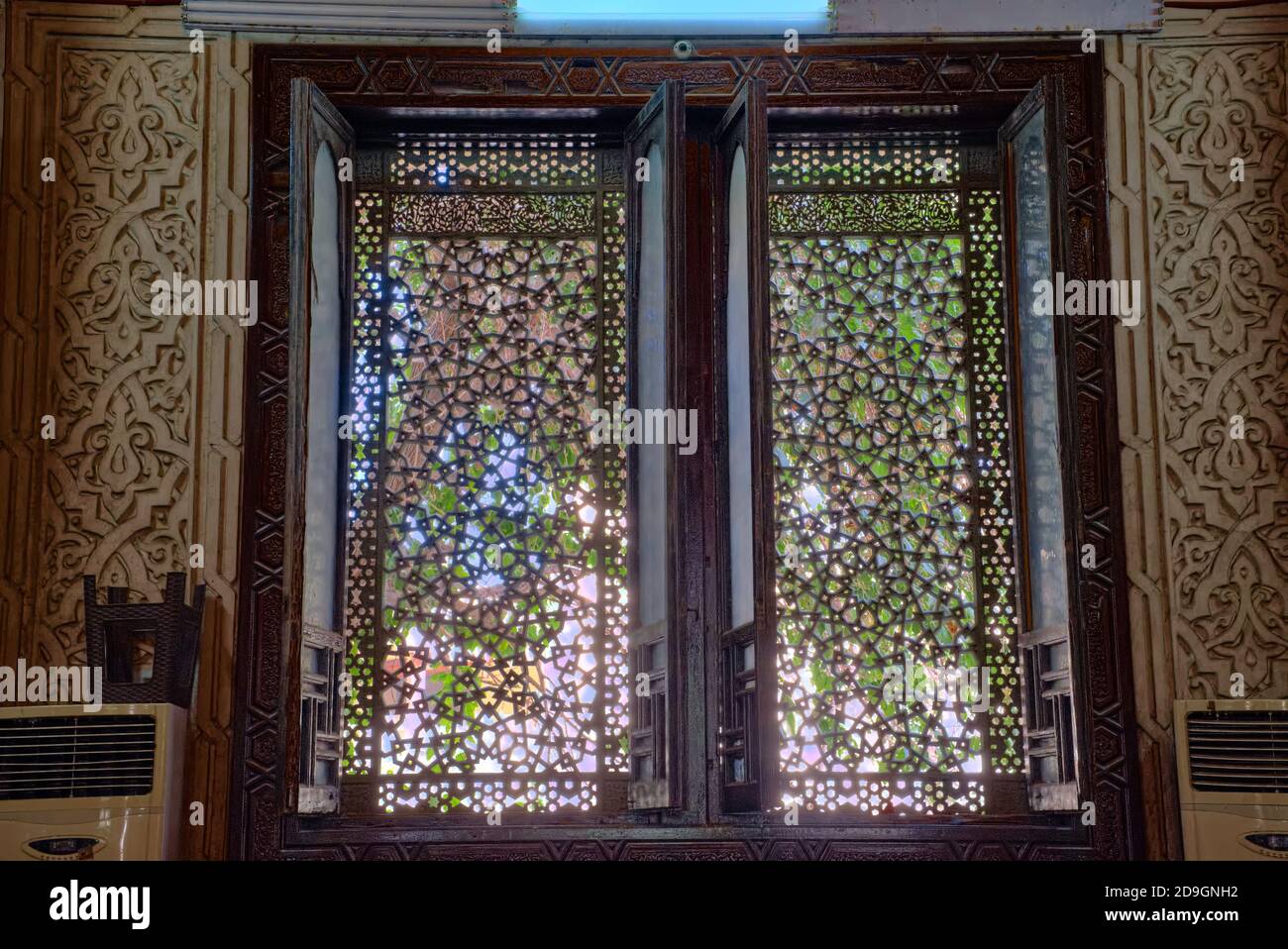 The doors, minbar and windows are made of joined and finely carved teak
