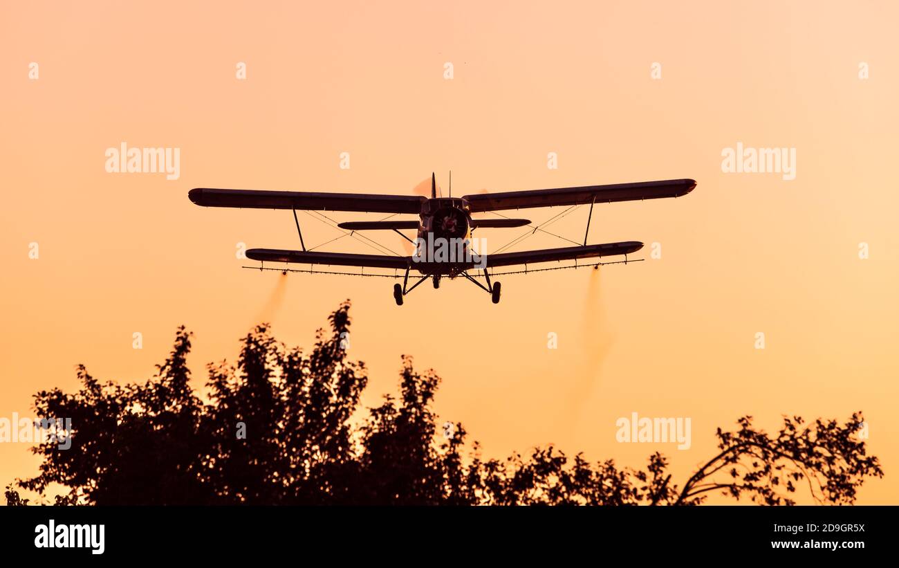 Cropduster plane spraying mosqitos Stock Photo
