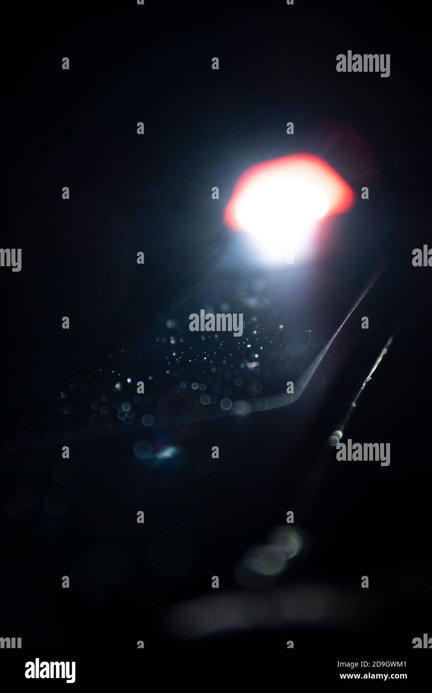 Flashlight lighten blurred dust in the dark. Stock Photo