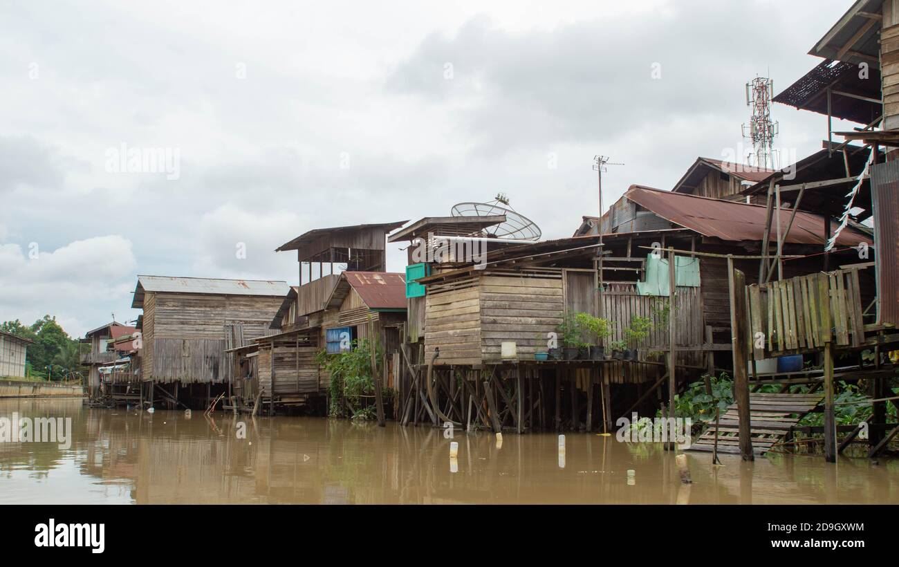 Wooden house on Karang Mumus Riverbank. Slum area on Karang Mumus river ...